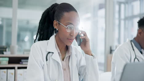 Phone-call,-laptop-and-a-black-woman-doctor