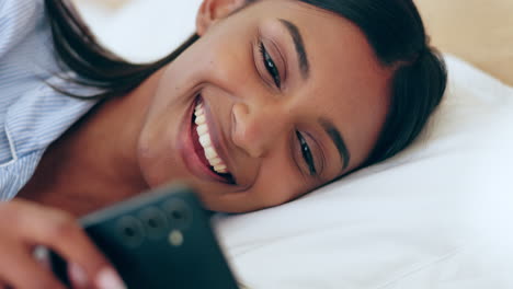 Bed,-phone-and-happy-woman-relax-typing-on-social