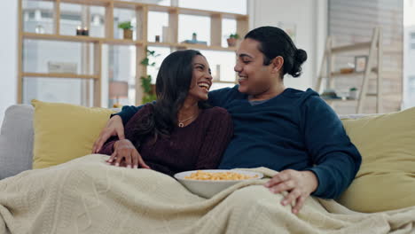 Popcorn,-food-and-couple-on-sofa-in-home