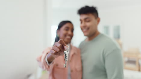 Hands,-couple-and-kiss-with-keys-in-new-home