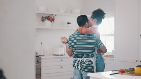 Love,-happy-and-couple-dance-in-the-kitchen