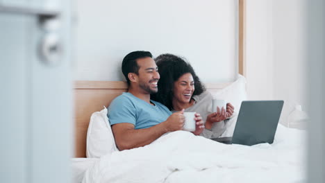 Laptop,-tea-and-laughing-with-a-couple-in-bed