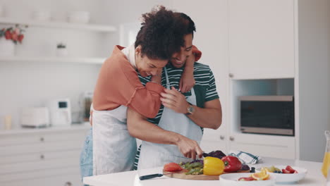 Hug,-food-and-a-couple-in-the-kitchen-for-cooking