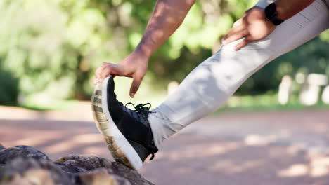 Exercise,-hands-on-feet-and-stretching-outdoor