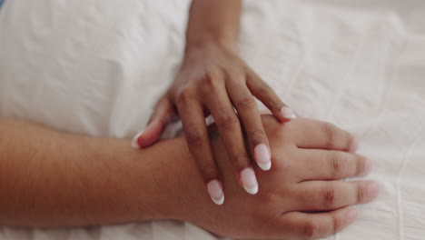 Love,-intimacy-and-hands-of-couple-in-bed