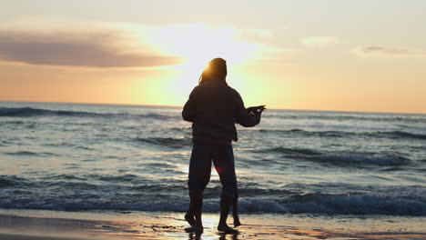 Silhouette,-dance-and-a-couple-at-the-beach-during