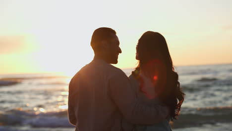 Love,-sunset-and-silhouette-of-couple-at-beach