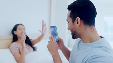 Couple,-happy-and-photography-on-phone-in-bedroom