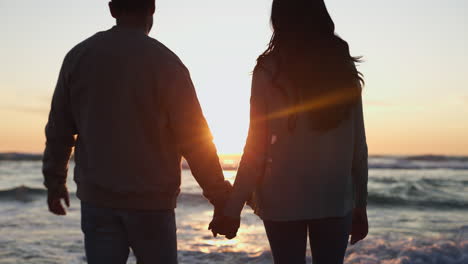 Holding-hands,-sunset-and-silhouette-of-couple