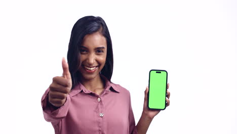 Woman,-thumbs-up-and-green-screen-phone-in-studio