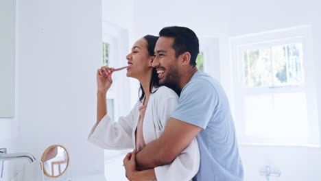 Bathroom-hug,-love-and-happy-couple-brushing-teeth