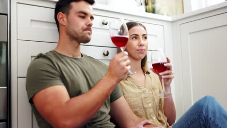 Couple-on-floor-drinking-red-wine