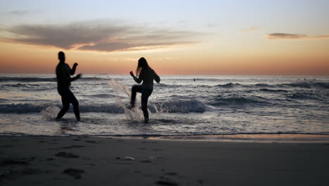 Couple-are-running-into-ocean