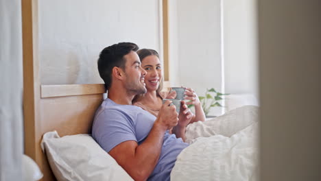 Conversation,-coffee-and-couple-in-bed-together