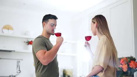 Couple-in-kitchen-with-wine