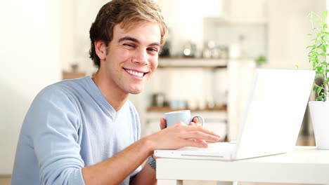 happy-man-using-laptop-computer