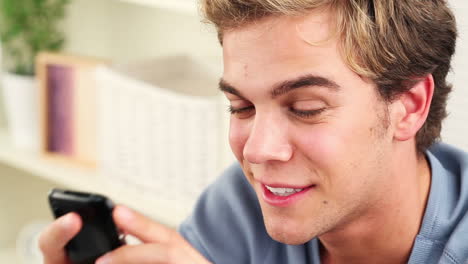 Close-up-of-young-man-using-mobile-phone