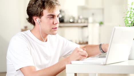 young-man-listening-to-music-at-home