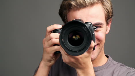 Photographer-man-taking-photographs-digital-camera