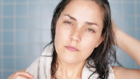 healthy-young-woman-in-bathroom-waking-up-portrait