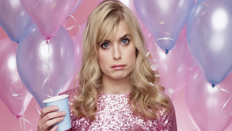 Sad-lonely-woman-celebrating-birthday-party-alone-pink-and-blue-balloon-background---Red-Epic-Dragon