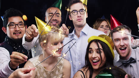 Mixed-race-group-of-friends-celebrating-independence-day-slow-motion-party-photo-booth