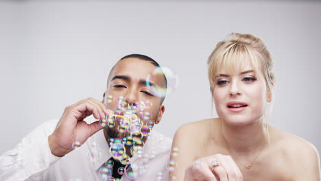 couple-blowing-bubbles-slow-motion-wedding-photo-booth-series