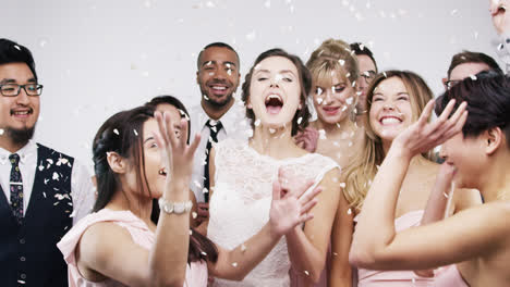 Multi-racial-group-of-friends-dancing-slow-motion-wedding-photo-booth-series