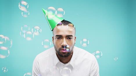 Single-man-is-sad-in--bubble-shower-slow-motion-photo-booth-blue-background