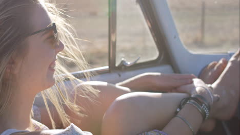 beautiful-blonde-friend-enjoying-road-trip-in-vintage-convertible-car