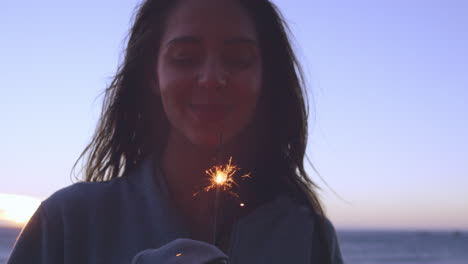 Teenage-girls-celebrating-and-laughing-with-bright-sparklers