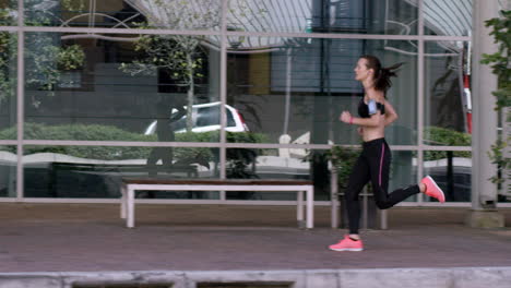 Athletic-running-fitness-woman-in-urban-city