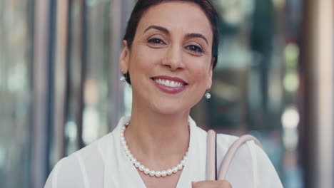 Portrait-of-Middle-Eastern-Businesswoman-outside-corporate-office-building