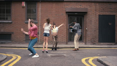 Group-of-multi-racial-dancers-street-dancing-funky-freestyle-in-the-city
