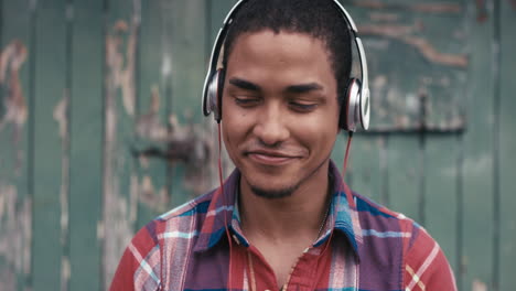Slow-Motion-Portrait-of-mixed-race-man-listening-to-music