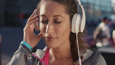 Slow-Motion-Portrait-of-happy-beautiful-fitness-woman-listening-to-music