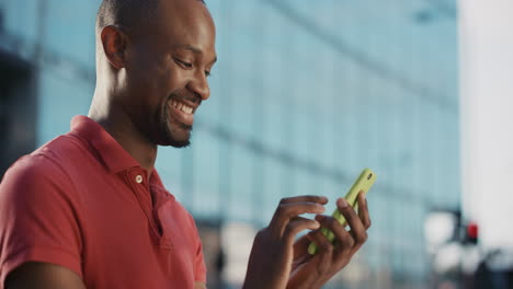 Slow-Motion-Portrait-of-african-american-man-using-smart-phone