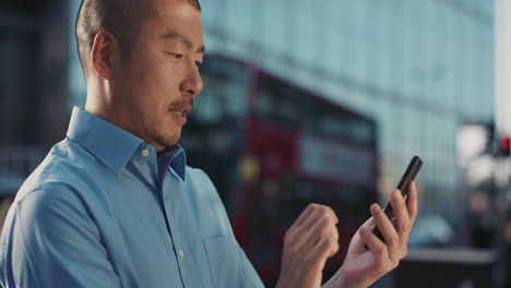 Slow-Motion-Portrait-of-Japanese-businessman-using-smart-phone