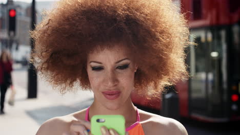 Slow-Motion-Portrait-of-funky-mixed-race-woman-using-smart-phone