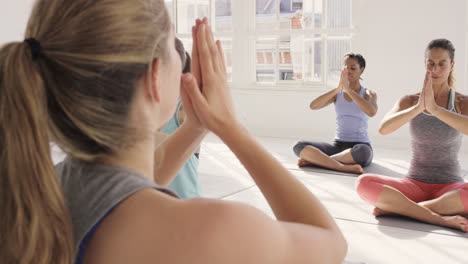 Yoga-class-multi-racial-group-of-women-exercising-fitness-healthy-lifestyle