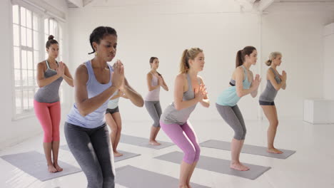 Yoga-class-multi-racial-group-of-women-exercising-fitness-healthy-lifestyle