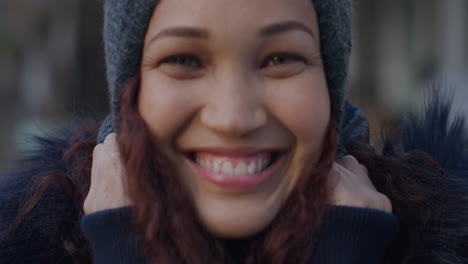 Portrait-cute-woman-smiling-pulling-hat-down-happy