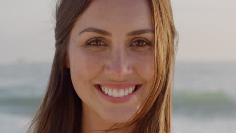 Portrait-beautiful-young-woman-smiling-at-sunset-on-beach-brazilian-lady-enjoying-lifestyle