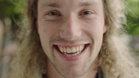 close-up-portrait-of-attractive-young-caucasian-man-laughing-cheerful-looking-at-camera