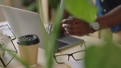 businessman-hands-typing-using-laptop-keyboard-drinking-coffee-beverage-sending-email-message-browsing-online-internet