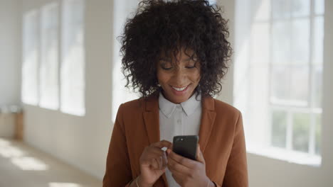 portrait-of-beautiful-african-american-woman-using-smartphone-texting-browsing-online-social-media-enjoying-reading-messaging-on-mobile-phone-wearing-stylish-fashion