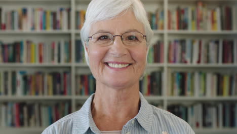close-up-portrait-of-elegant-middle-aged-woman-teacher-smiling-happy-looking-at-camera-elderly-lady-wearing-glasses-in-library