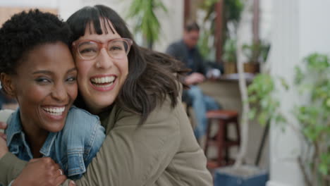 portrait-of-young-woman-suprise-hugging-friend-diverse-girlfriends-embracing-laughing-enjoying-friendship-hang-out-together-in-urban-background