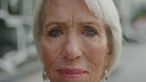 close-up-portrait-of-middle-aged-woman-looking-at-camera-thoughtful-pensive-enjoying-retirement-in-urban-city-real-people-series