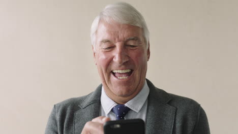portrait-of-happy-businessman-portrait-of-positive-senior-entrepreneur-using-phone